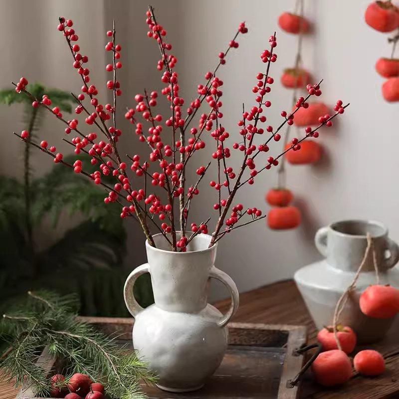 Faux Red Winterberry Stem by RusticReach arranged in a white ceramic vase on Tampa Home & Garden Store