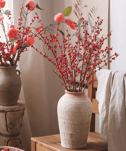 Two Faux Red Winterberry Stems by RusticReach in beige ceramic vases with red berry clusters on Tampa Home & Garden Store