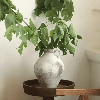 Watertight One Handle Pottery Vase with gray distressed glaze holding green leafy branches on Tampa Home & Garden Store