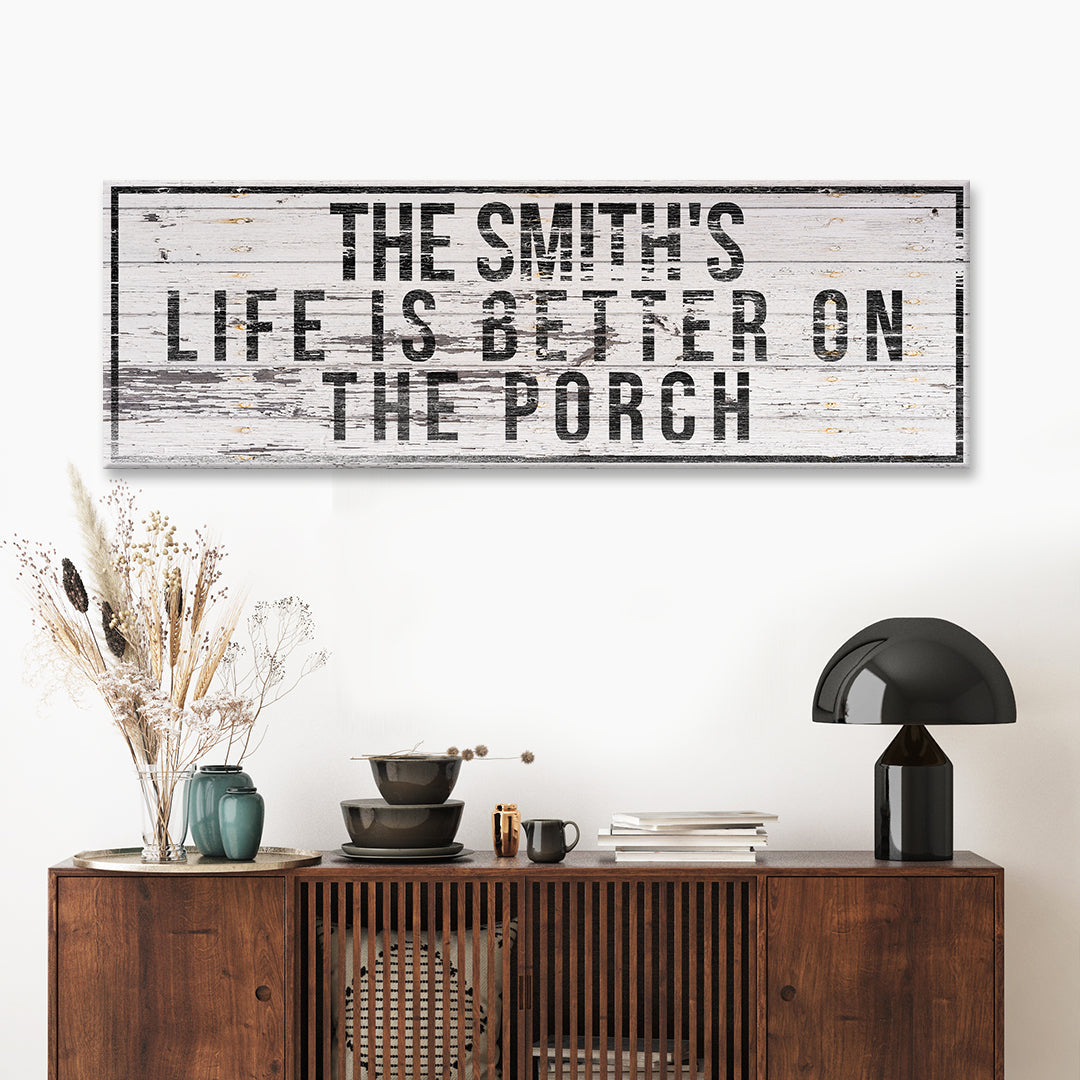Family Name Porch Sign canvas wall art in white wood with bold black letters on porch on Tampa Home & Garden Store