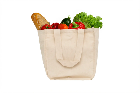 Organic canvas shopping tote bag filled with baguette, bell peppers, lettuce, and tomatoes on Tampa Home & Garden Store