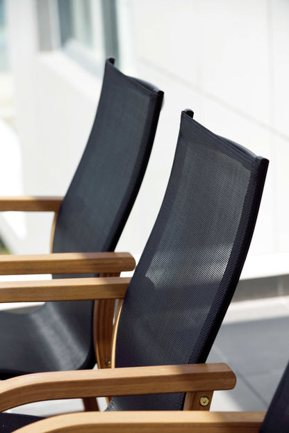 Rinjani dining table with 8 Manhattan black armchairs, mesh backs and wooden arms on Tampa Home & Garden Store