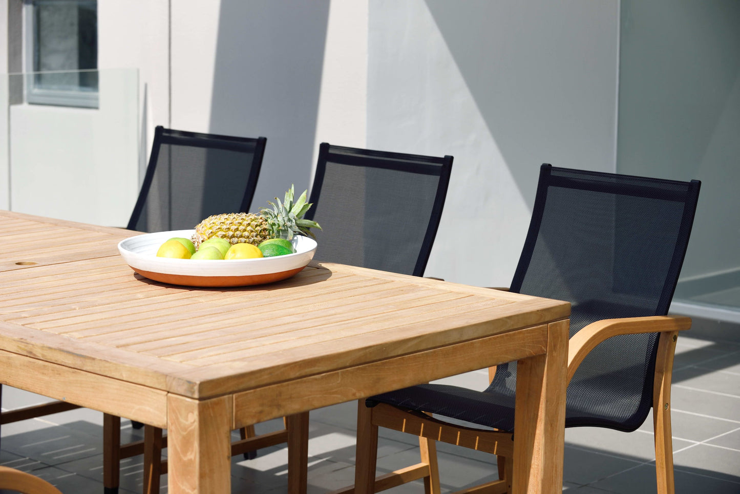 Rinjani rectangular dining table and 6 Manhattan black armchairs outdoor set LifestyleGarden US on Tampa Home & Garden Store