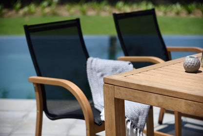 Rinjani rectangular outdoor dining table with Manhattan black armchairs LifestyleGarden US set on Tampa Home & Garden Store