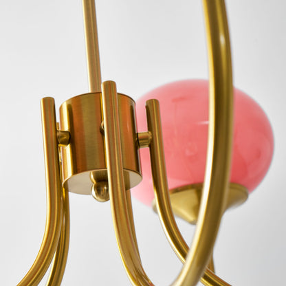 Chandelier Marshmallow by Moktan Sabai featuring a gold metal frame and pink hand-sprayed glass bubble shade on Tampa Home & Garden Store