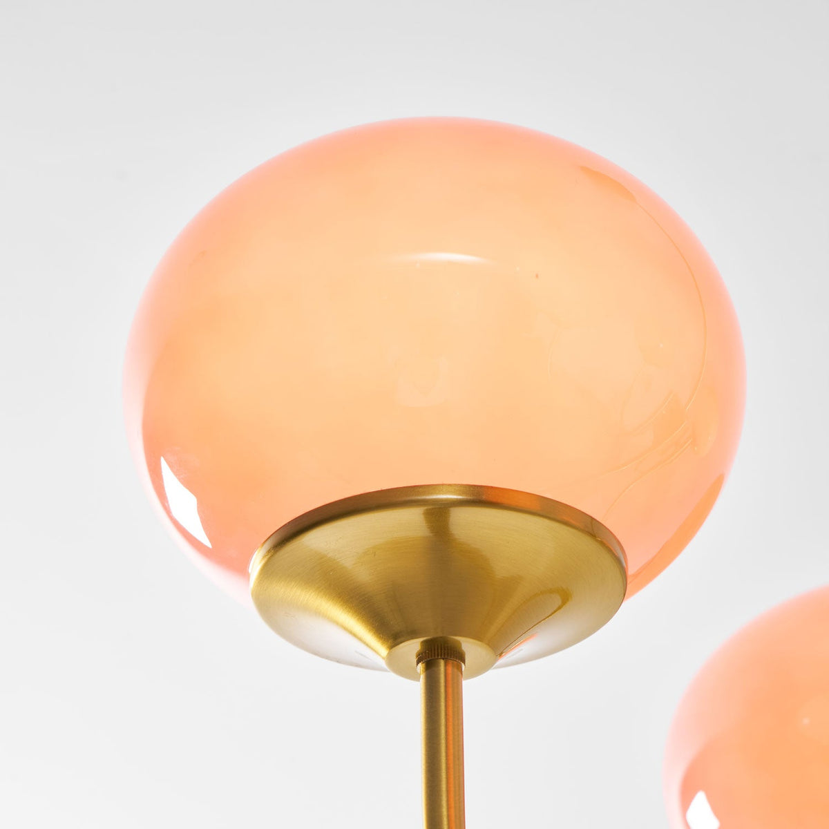 Chandelier Marshmallow by Moktan Sabai with 2 pink hand-sprayed glass globes and brass stem on Tampa Home & Garden Store