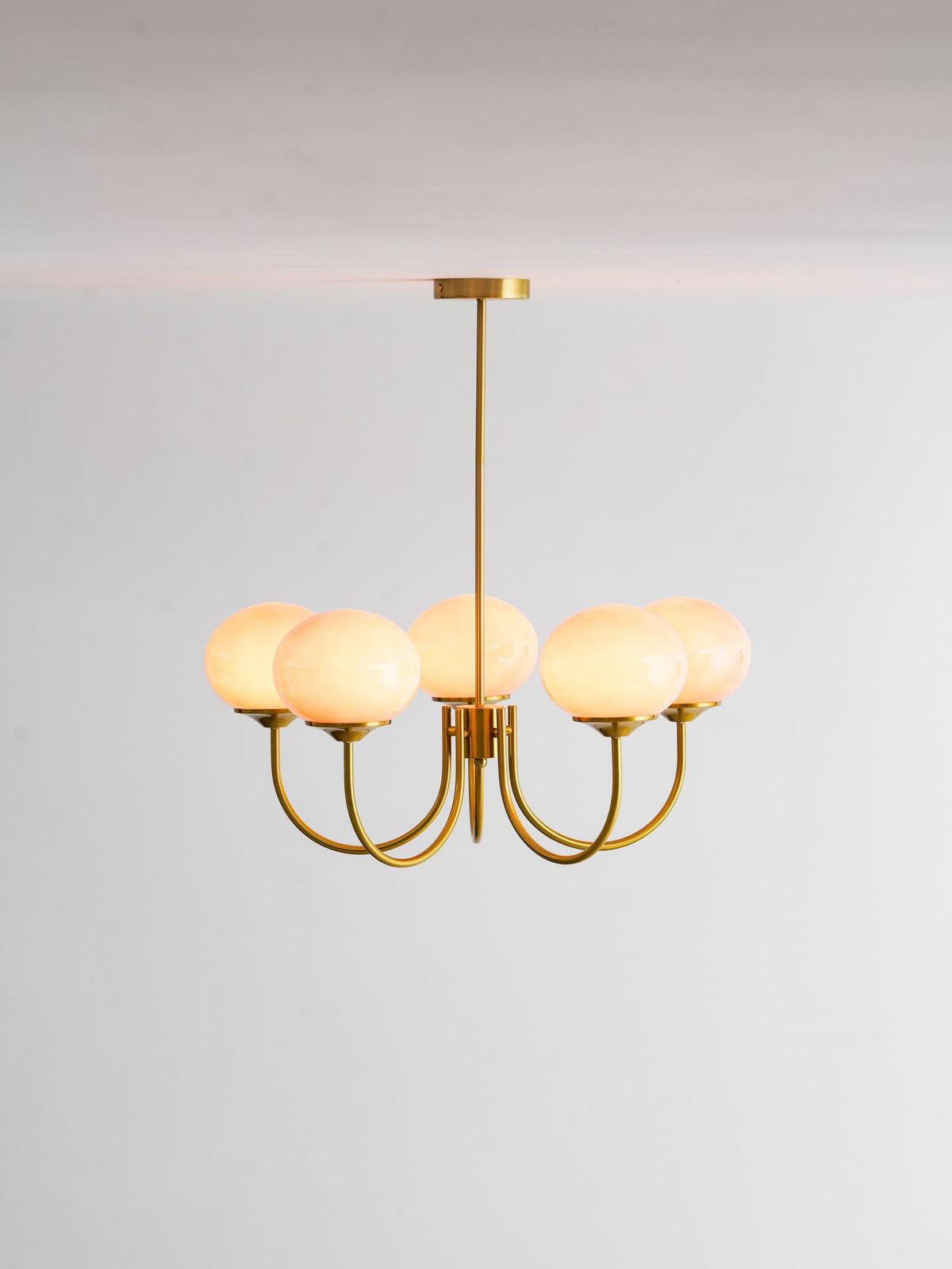 Marshmallow Chandelier by Moktan Sabai with hand-sprayed pink glass bubbles brass finish on Tampa Home & Garden Store