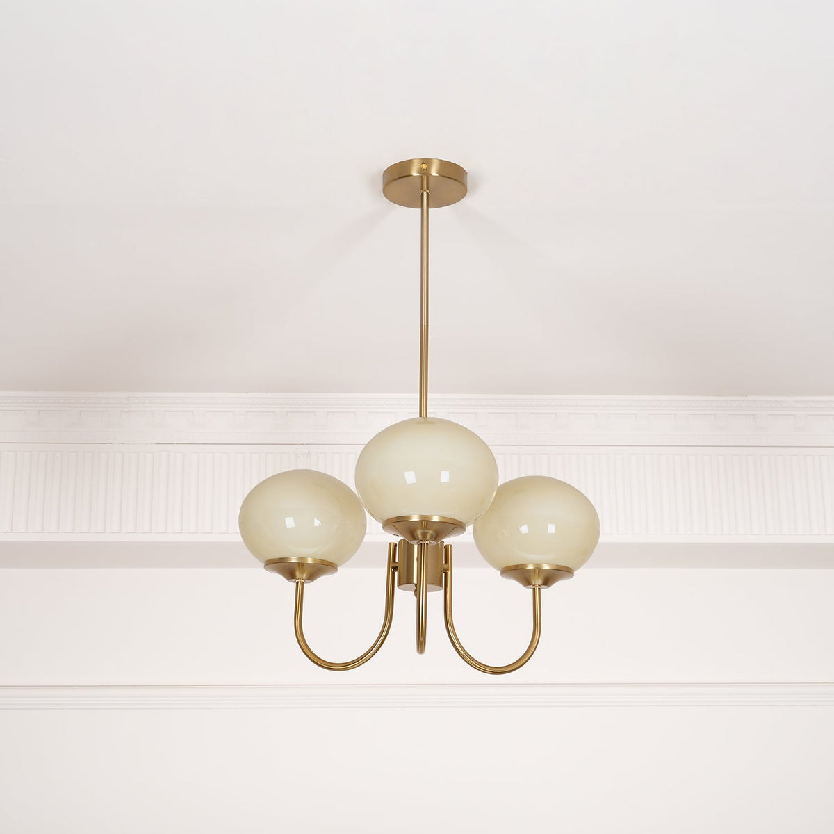 Marshmallow modern glass bubble chandelier with brass stem and frosted cream globe shades on Tampa Home & Garden Store