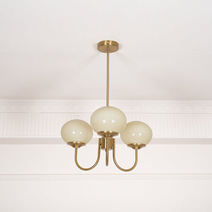 Marshmallow modern glass bubble chandelier with brass stem and frosted cream globe shades on Tampa Home & Garden Store