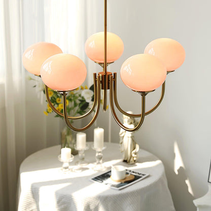 Marshmallow modern glass bubble chandelier with five pink globe shades and brass arms on Tampa Home & Garden Store