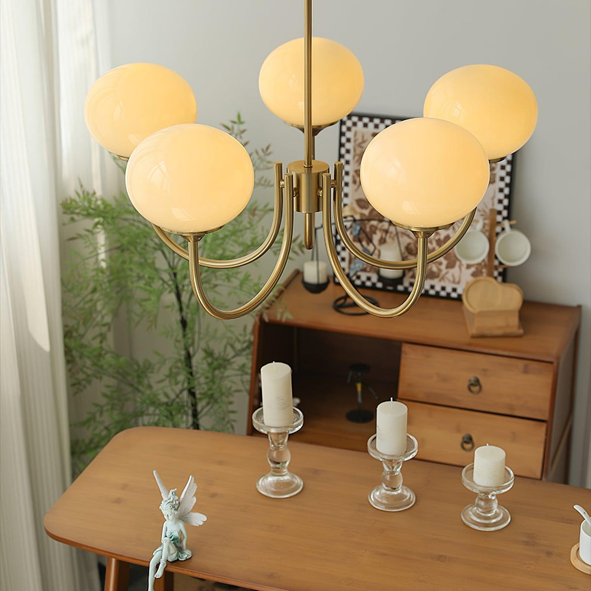 Marshmallow modern glass bubble chandelier with pink-tinted globes and brass arms on Tampa Home & Garden Store