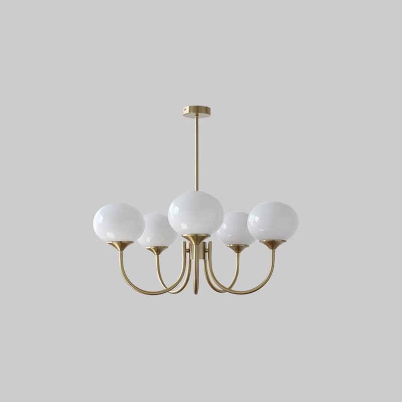 Marshmallow chandelier: gold brass frame with six white glass bubble shades on curved arms on Tampa Home & Garden Store