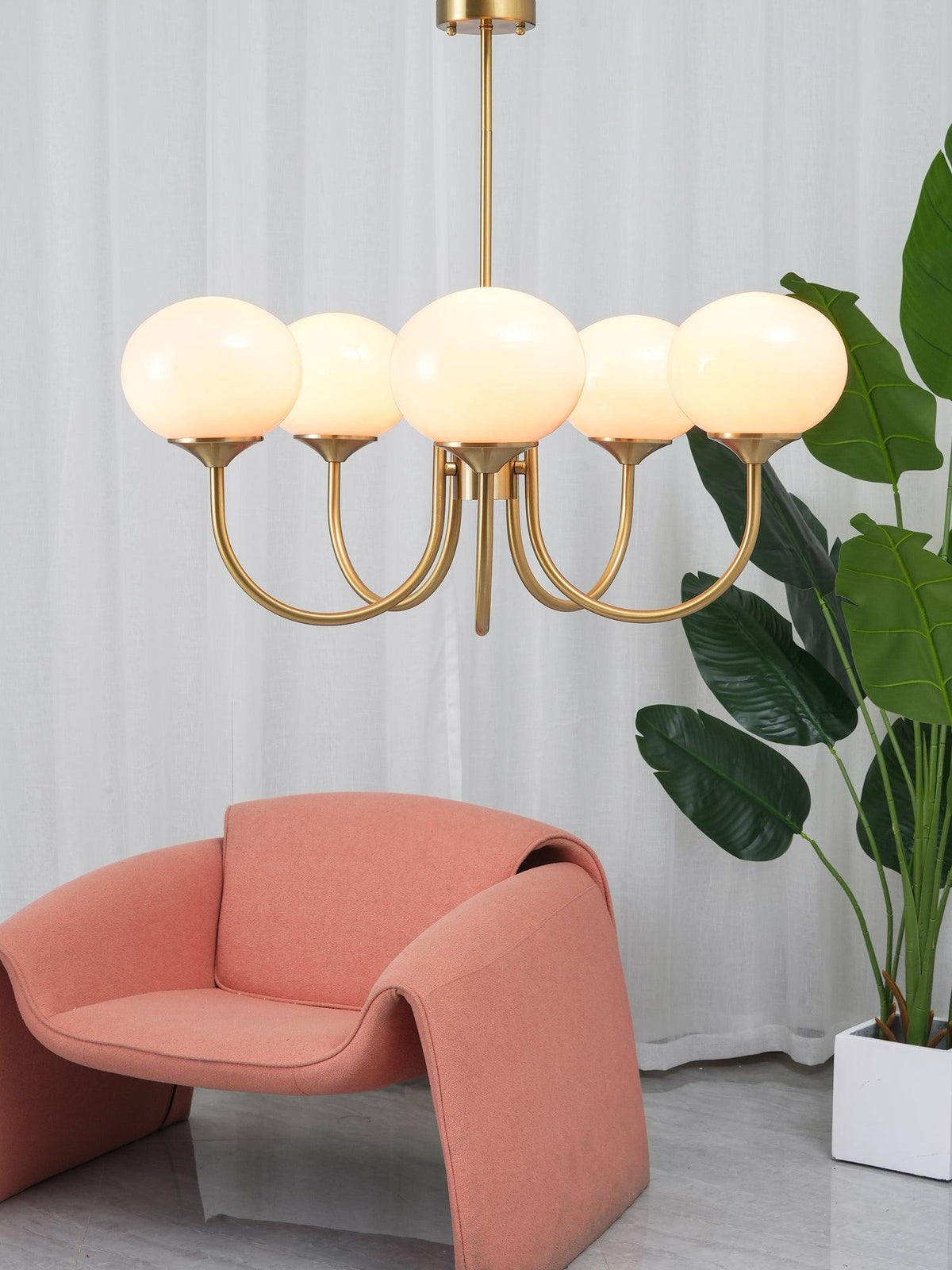 Chandelier Marshmallow by Moktan Sabai featuring five pink glass globes with brass finish on Tampa Home & Garden Store