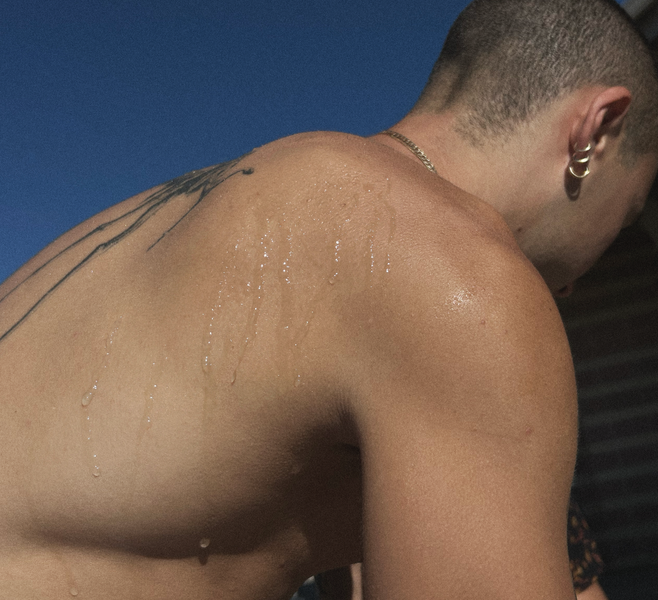 Antibacterial body wipes product image: shirtless man with a wet back and shoulder tattoo on Tampa Home & Garden Store