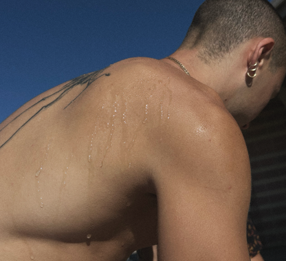 Antibacterial body wipes product image: shirtless man with a wet back and shoulder tattoo on Tampa Home & Garden Store