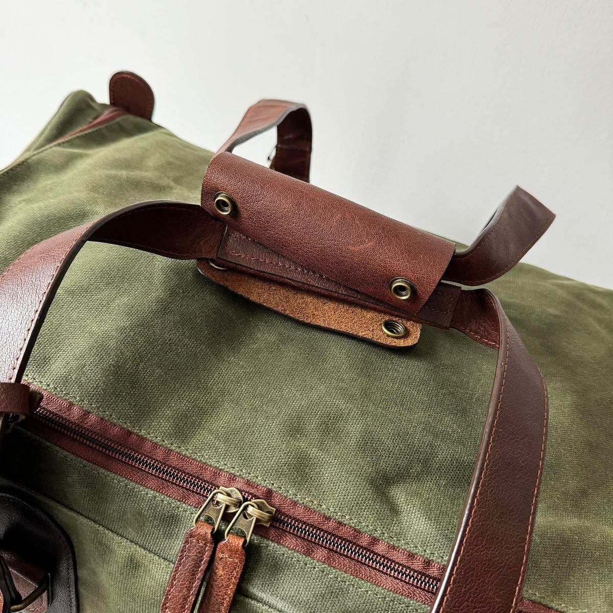 Maxwell Waxed Canvas Rolling Duffel Bag olive canvas with leather trim by MiamiLeathers.com on Tampa Home & Garden Store