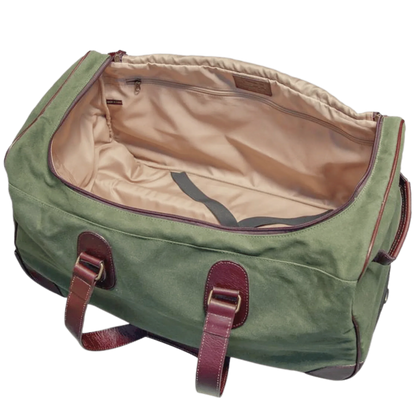 Maxwell Waxed Canvas Rolling Duffel Bag in green with beige lining and leather straps on Tampa Home & Garden Store