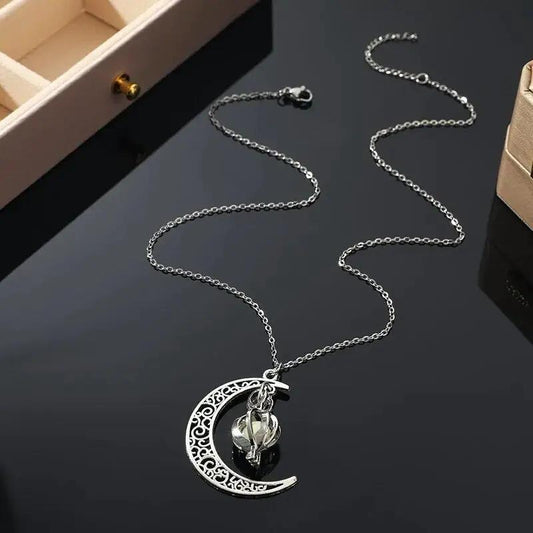 Moonstone pendant necklace in stainless steel with a filigree crescent charm on Tampa Home & Garden Store