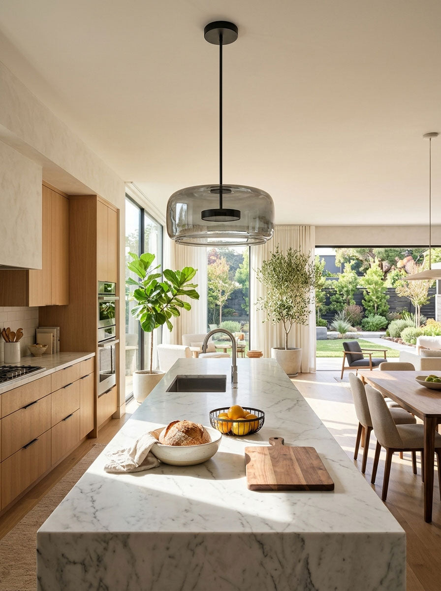 Glass Sphere Pendant Light with Warm LED, smoke-grey glass over marble island by Moktan Sabai on Tampa Home & Garden Store