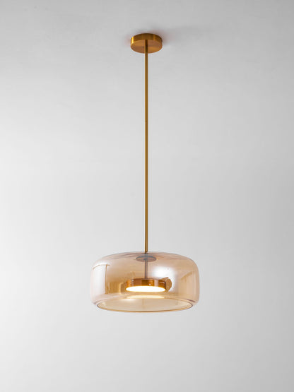 Hand-blown glass sphere pendant light with warm LED amber shade brass stem on Tampa Home & Garden Store