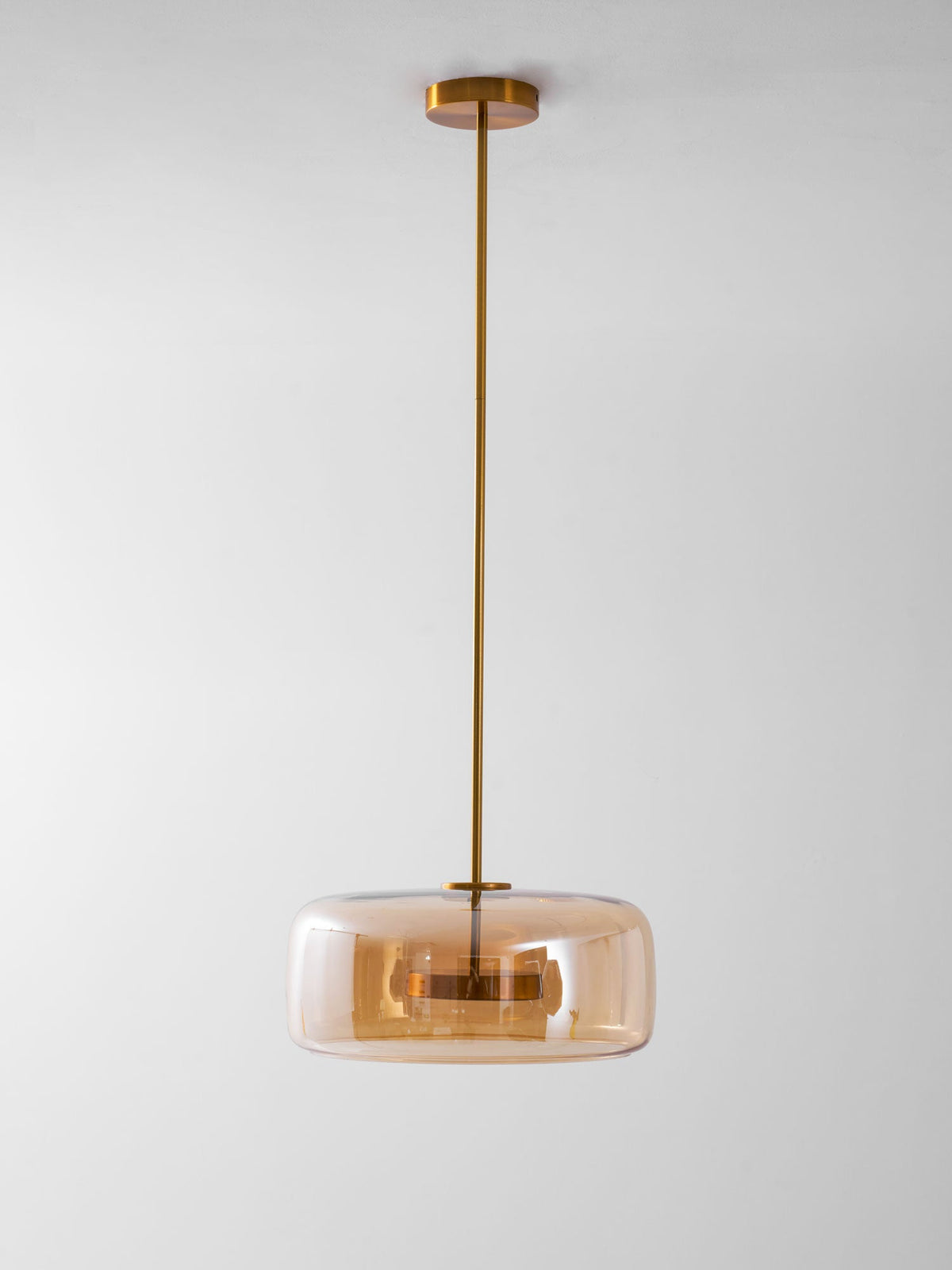 Pendant light Moktan Sabai hand-blown glass sphere with warm LED, amber shade, brass stem on Tampa Home & Garden Store