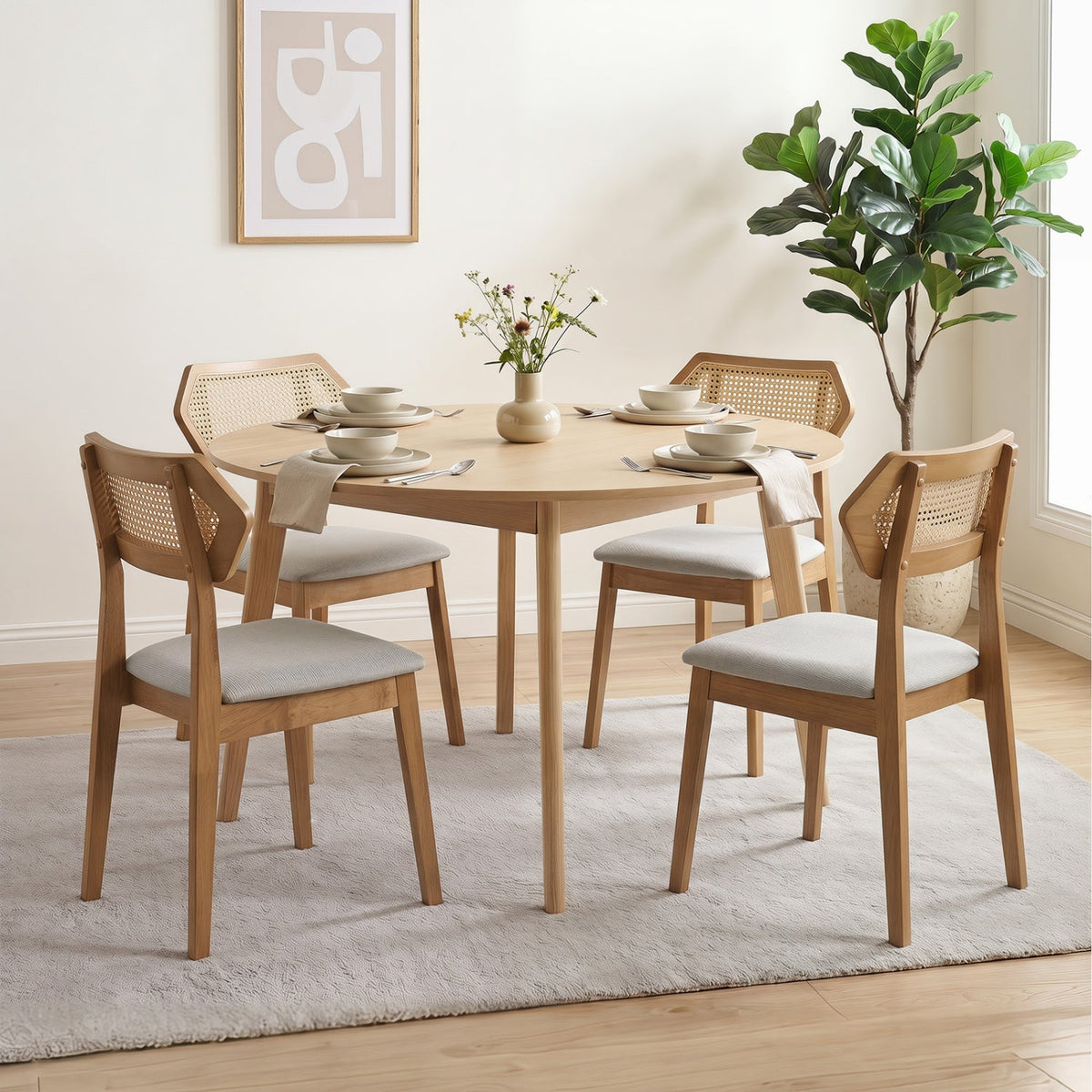 Rattan dining chairs set of 4 with curved backs, gray cushions around a round table on Tampa Home & Garden Store