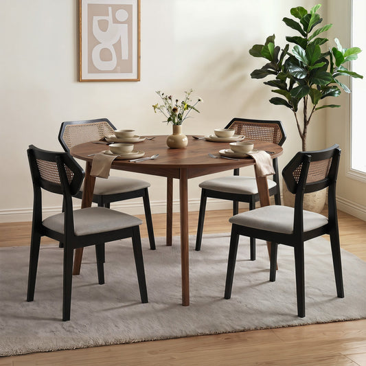 Rattan dining chairs set of 4 with curved backs, black frames and cushions around round table on Tampa Home & Garden Store