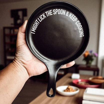Lick the Spoon & Cook spoon rest by Gia Roma, black round skillet with white slogan on Tampa Home & Garden Store