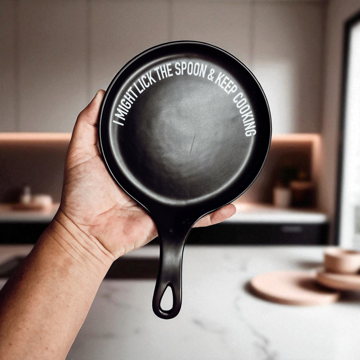 Lick the Spoon & Cook spoon rest, black round enamel kitchen accessory with white edge text on Tampa Home & Garden Store