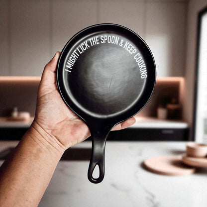 Lick the Spoon & Cook spoon rest, black round enamel kitchen accessory with white edge text on Tampa Home & Garden Store