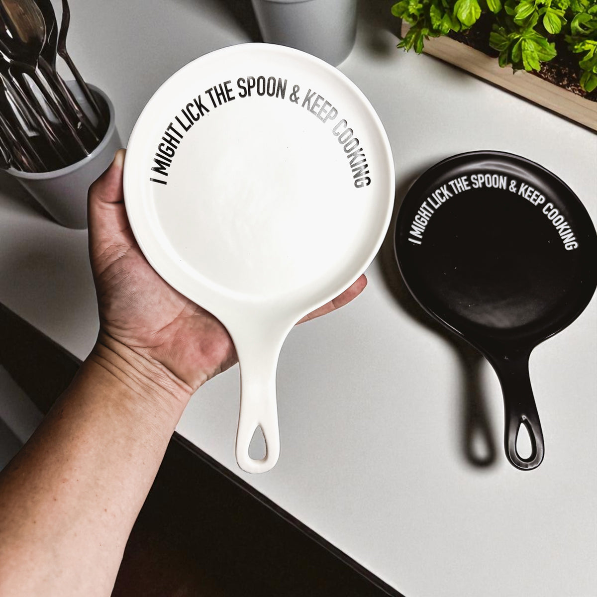 Spoon rest Lick the Spoon & Keep Cooking by Gia Roma, white ceramic with bold text on Tampa Home & Garden Store