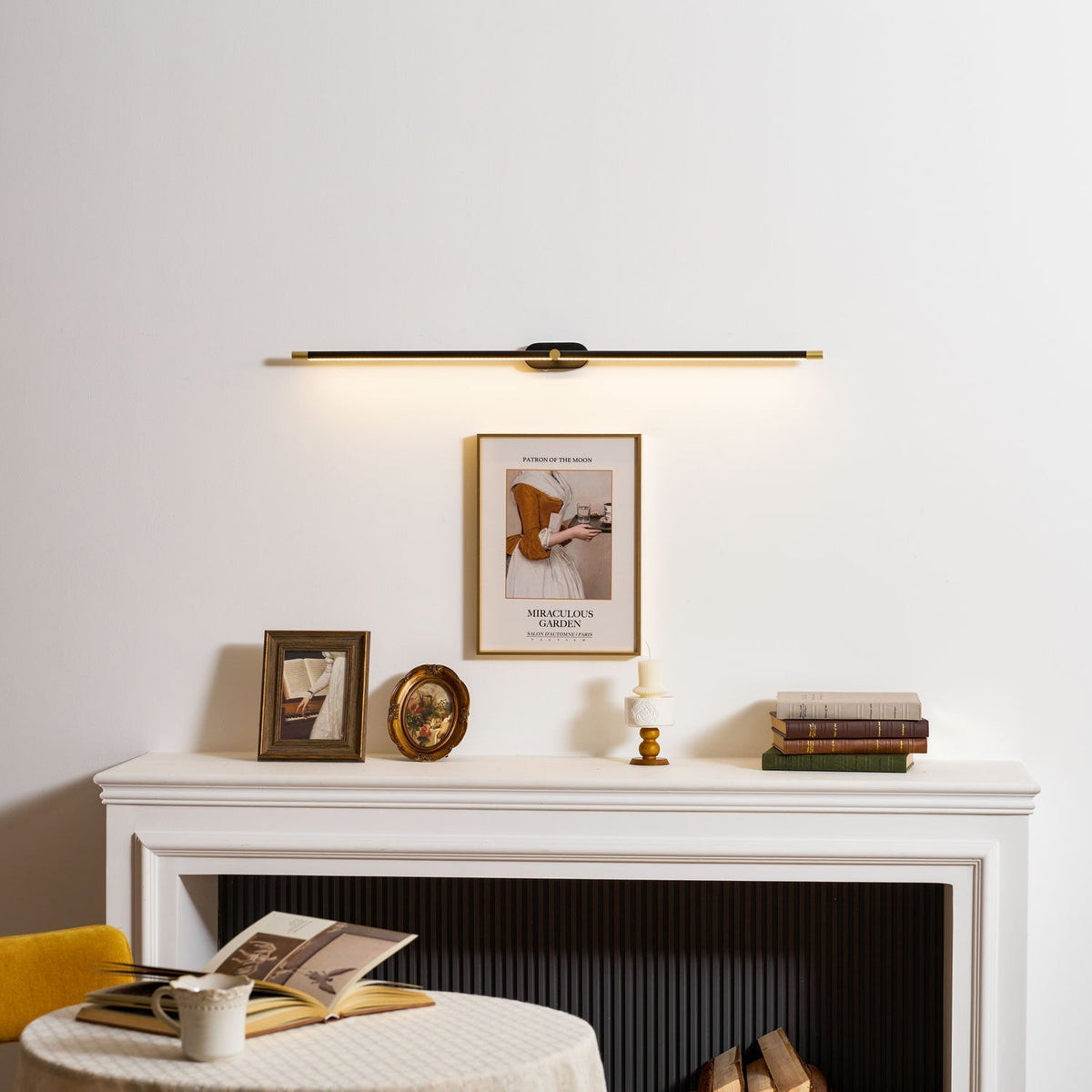 Rechargeable linear LED wall lamp by Moktan Sabai black bar with gold ends, cordless remote on Tampa Home & Garden Store