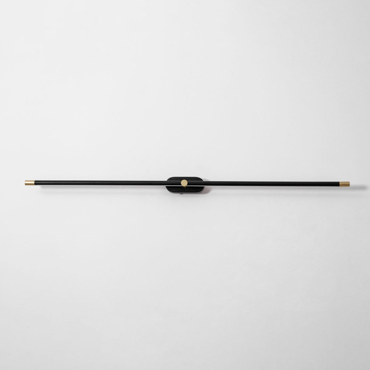 Rechargeable linear LED wall lamp with remote, black bar with gold ends, Moktan Sabai wall light on Tampa Home & Garden Store