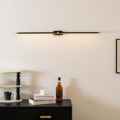 Moktan Sabai cordless LED wall light, black body with gold end caps mounted on wall on Tampa Home & Garden Store