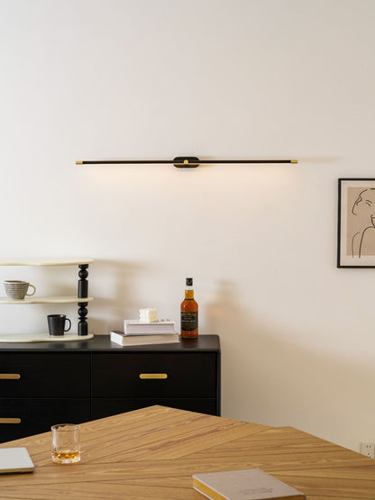 Rechargeable linear LED wall lamp cordless Moktan Sabai, black bar with brass ends, remote on Tampa Home & Garden Store