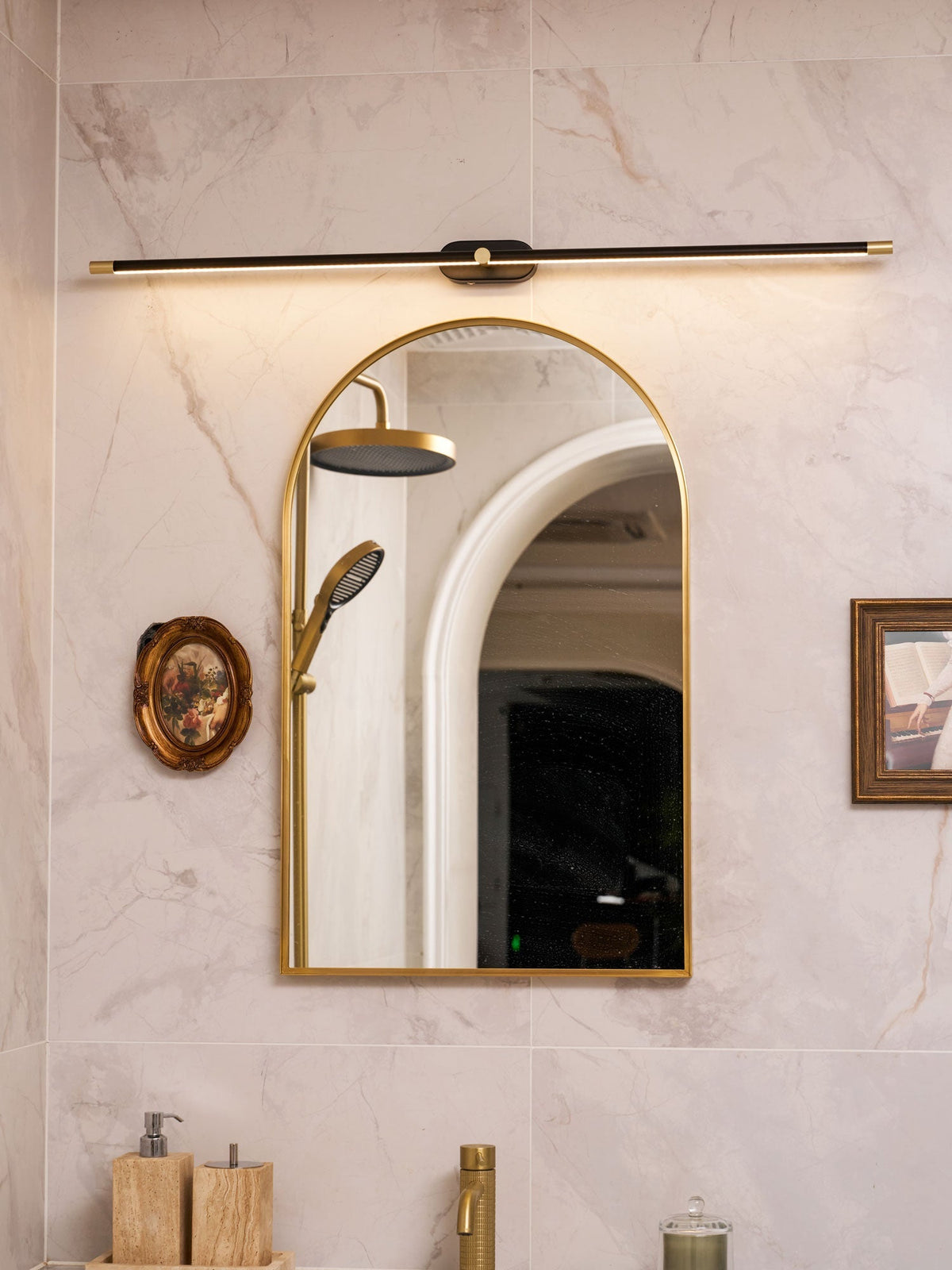 Rechargeable linear LED wall lamp with remote, black bar with brass ends over bathroom mirror on Tampa Home & Garden Store