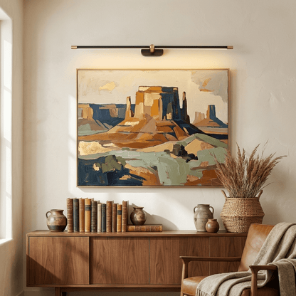 Rechargeable LED wall lamp with remote in black brass by Moktan Sabai above framed art on Tampa Home & Garden Store