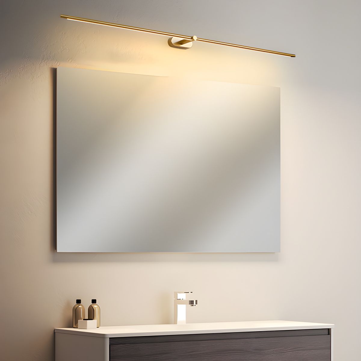 Rechargeable linear LED wall lamp with remote by Moktan Sabai, gold bar above mirror on Tampa Home & Garden Store