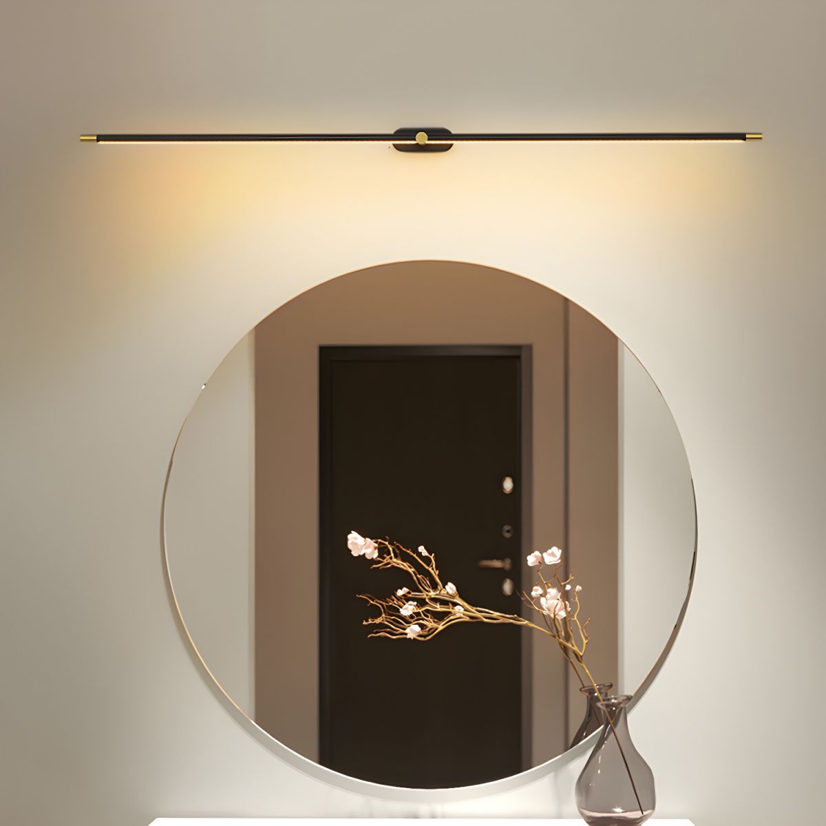 Rechargeable Linear LED Wall Lamp with Remote by Moktan Sabai black bar above a round mirror on Tampa Home & Garden Store