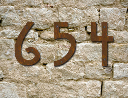 Rustic Mission Style metal house numbers 6 5 4 on a stone wall on Tampa Home & Garden Store