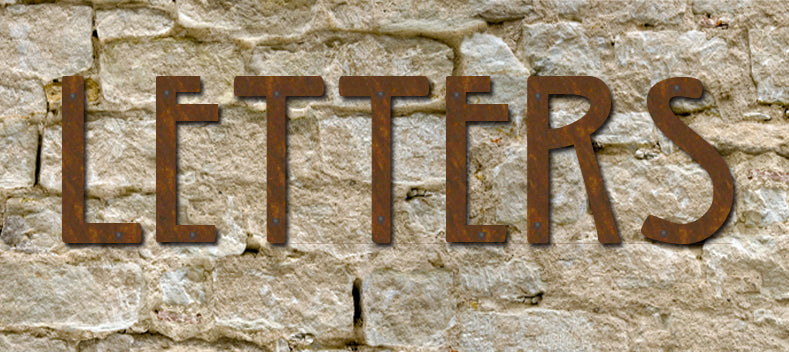 Rustic Mission style metal house numbers and letters set of 4 on textured stone wall on Tampa Home & Garden Store