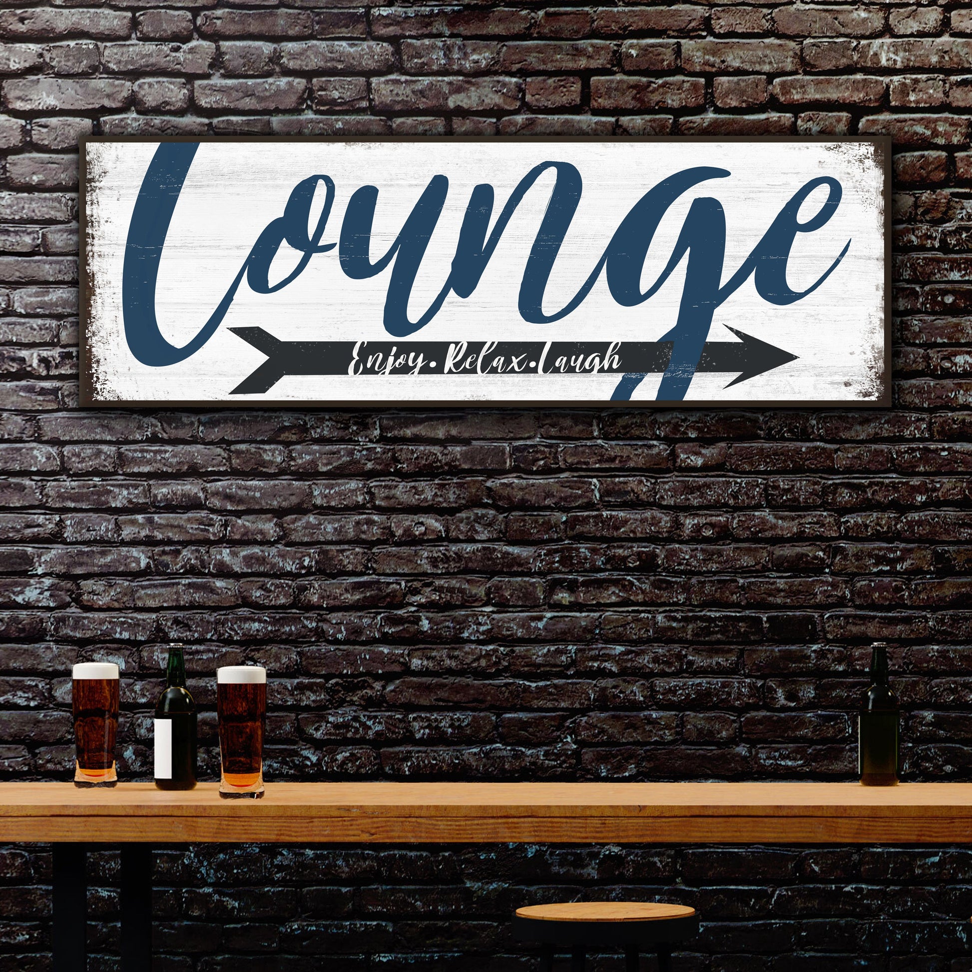 Enjoy Relax Laugh Lounge Sign canvas with blue script, black arrow on brick wall on Tampa Home & Garden Store