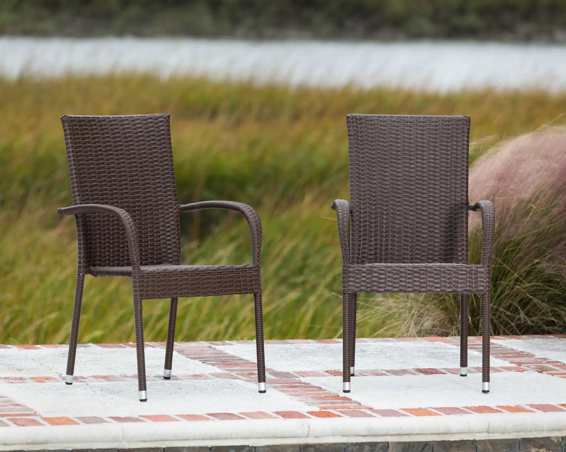 Morgan Outdoor Wicker Stacking Chairs mocha set of 4, two chairs shown outdoors on Tampa Home & Garden Store