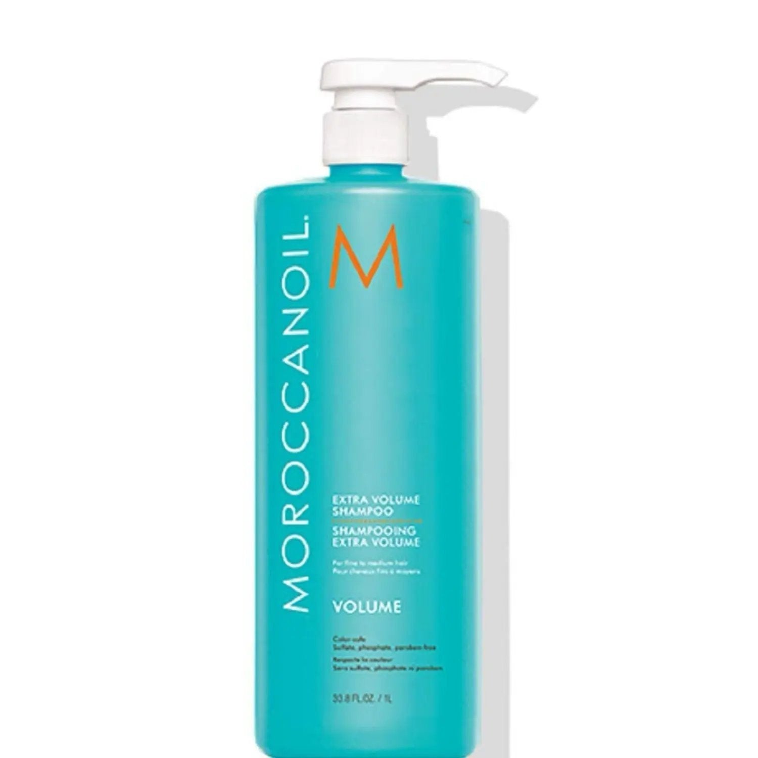 Moroccanoil Extra Volume Shampoo bottle in turquoise with white pump on Tampa Home & Garden Store
