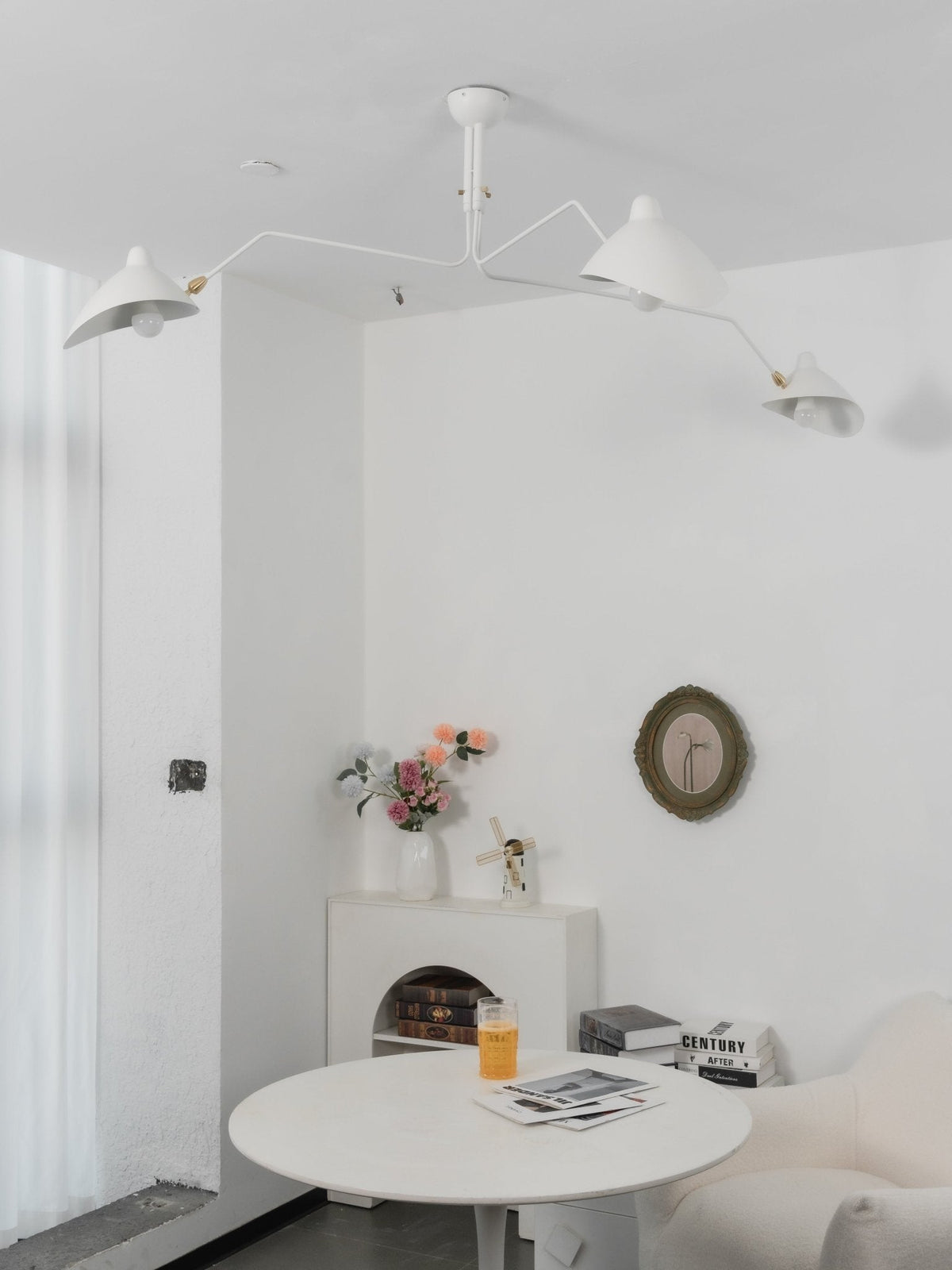 Arachnia suspended ceiling light by Moktan Sabai in white finish with rotating reflectors on Tampa Home & Garden Store