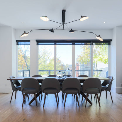Arachnia 3-arm suspended ceiling light with rotating reflectors in black over dining room table on Tampa Home & Garden Store