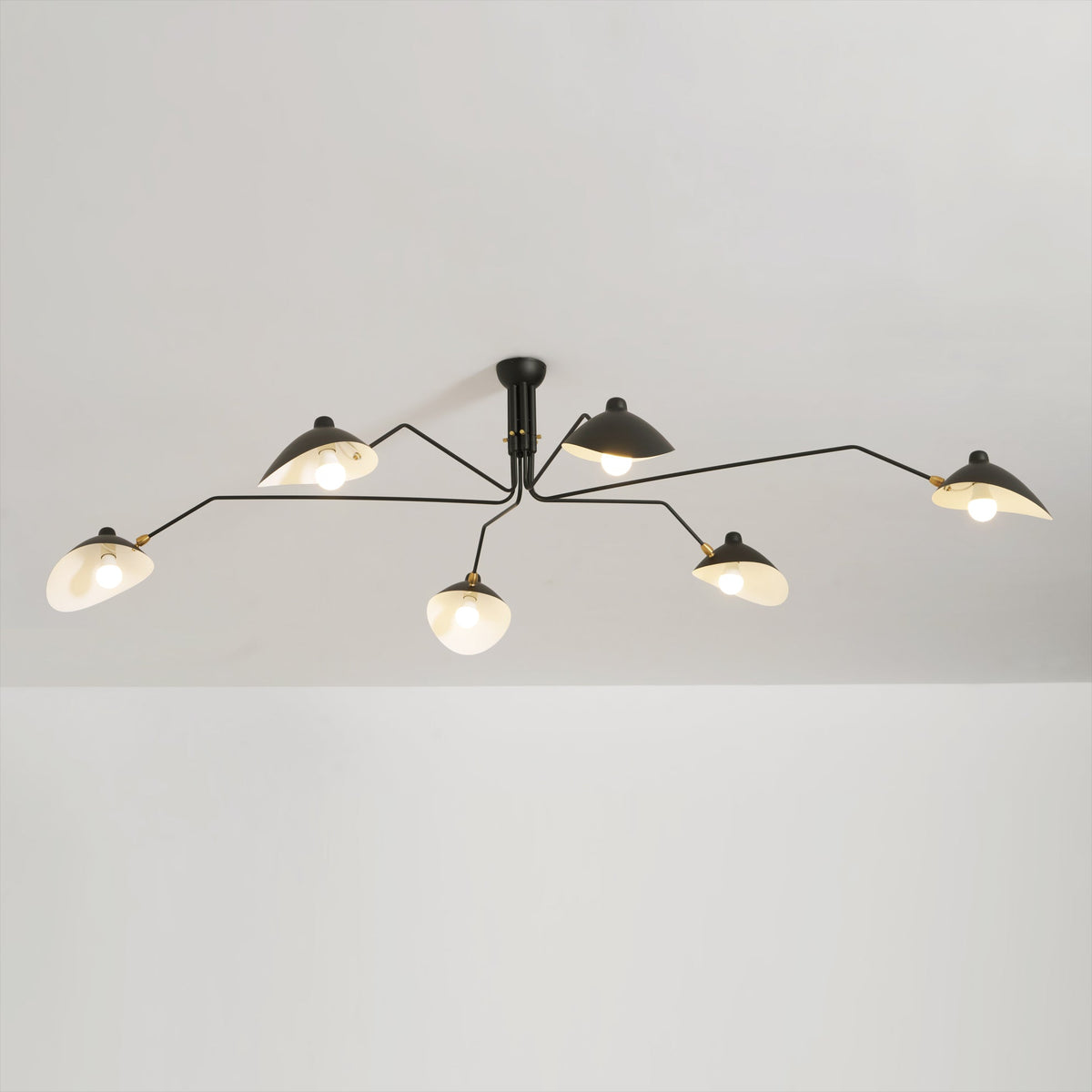 Arachnia ceiling light by Moktan Sabai with black metal frame white interior shades, rotating on Tampa Home & Garden Store