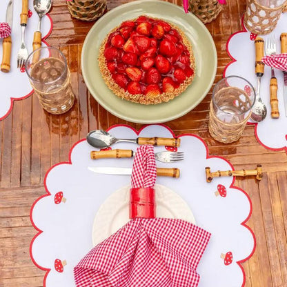 Mushroom placemat with red stitch border, white mat with mushroom motifs by Talah Home on Tampa Home & Garden Store