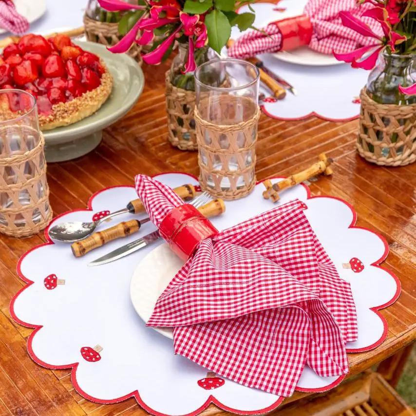 Mushroom placemat with red stitch border and white scalloped edge by Talah Home on Tampa Home & Garden Store