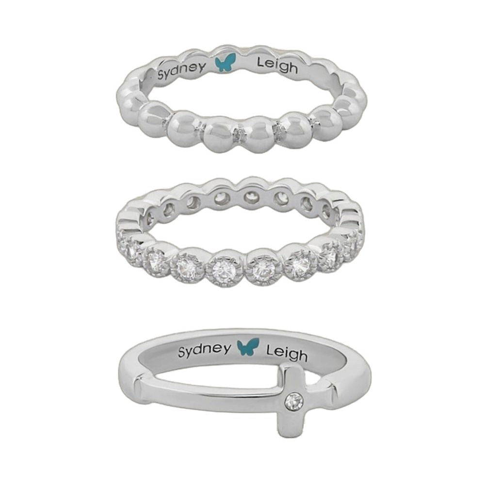 Three Sydney Leigh Cross Rings: silver-tone beaded band, pavé crystal band on Tampa Home & Garden Store